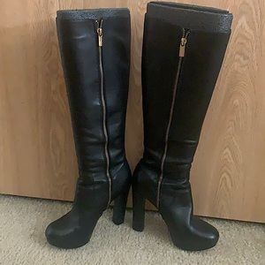 Black high heeled MK Boots, hits at the knee (not over the knee) length.